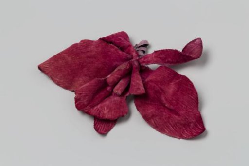 Corsage, orchid of violet velvet with short stem