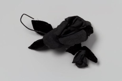 Corsage, rose of black tulle petals and black velvet leaves