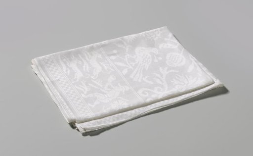 Napkin with scattered flowers, fruits, and birds
