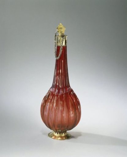 Bottle of ruby glass with flattened globular body with vertical ribs and gilded silver mount