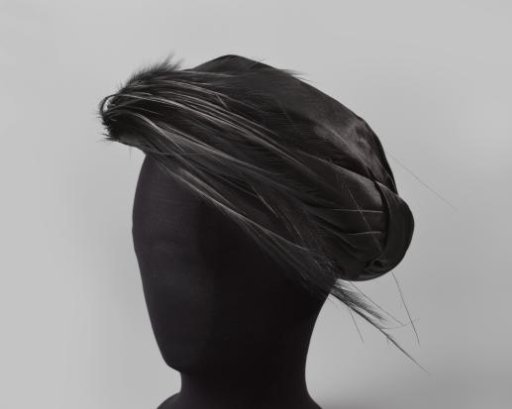 Turban of black satin with aigrette
