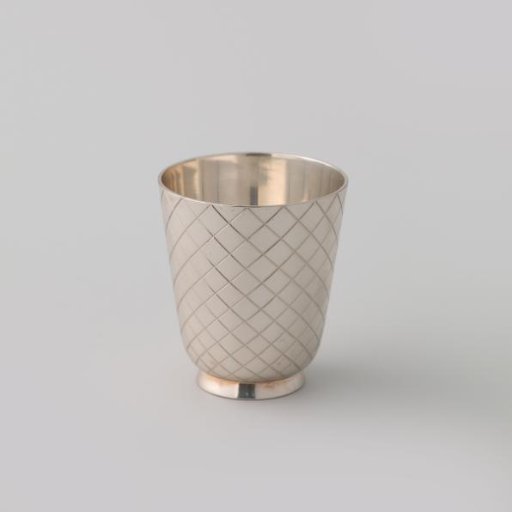 Cup, conical in shape, on a low, tapering foot. Body decorated with engraved lattice work