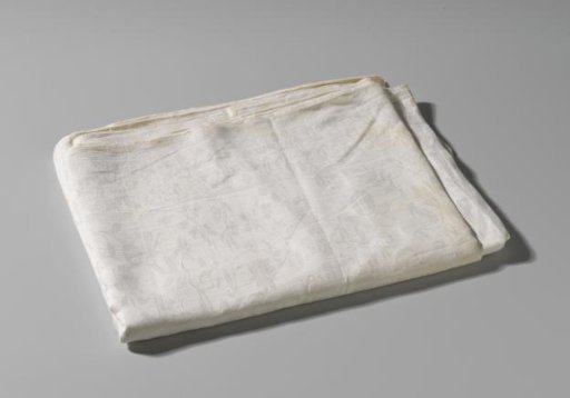 Tablecloth of linen damask with a pattern of scattered flowers