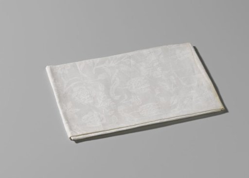 Napkin of white linen damask with coupled arms of Von Inn- und Kniphausen and Van Ewsum
