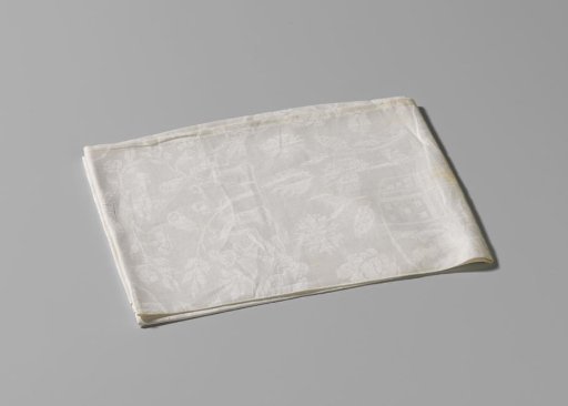 Napkin of white linen damask with the coupled arms of Von Inn- und Kniphausen and Van Ewsum