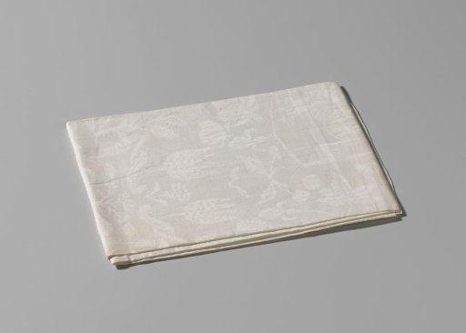 White linen damask napkin with the impaled coats of arms Von Inn- und Kniphausen and Van Ewsum