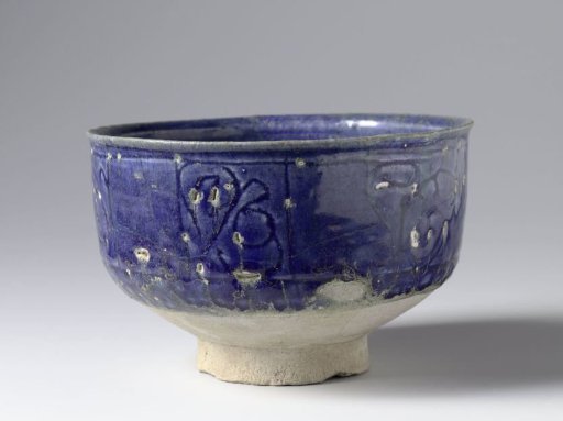 Bowl with incised scrolls in panels