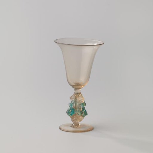 Chalice glass with tulip-shaped bowl and stem with three dolphins