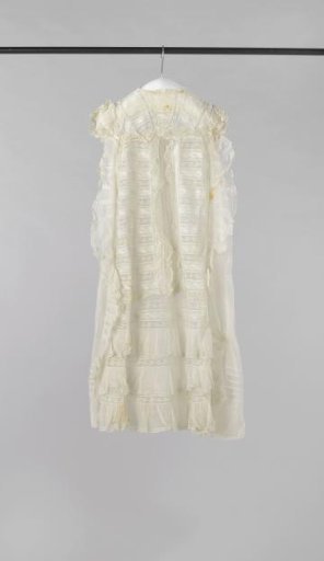 Christening gown with plumetis embroidery and lace ruffles