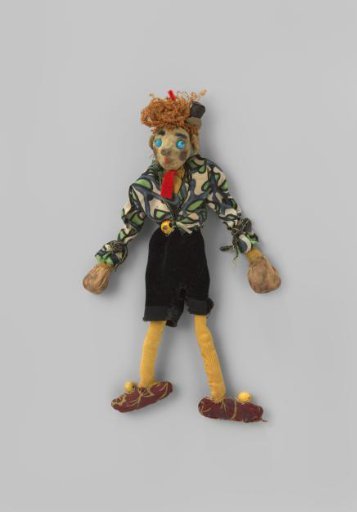 Marionette, boy with curly brown silk hair and small tall hat of paper, dressed in a jacket of printed Wiener Werkstätte silk, shirt of yellow cotton tricot, red wool necktie, black velvet breeches, yellow cotton tricot stockings, and shoes of printed Wiener Werkstätte silk