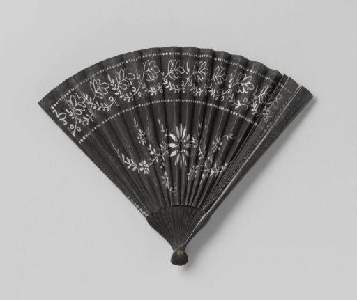 Folding fan of black paper with a white floral motif in watercolor and a mount of unadorned black lacquered wood