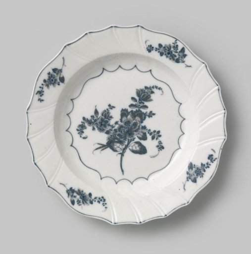 Plate, painted with flower branches and rushes around the mirror and rim