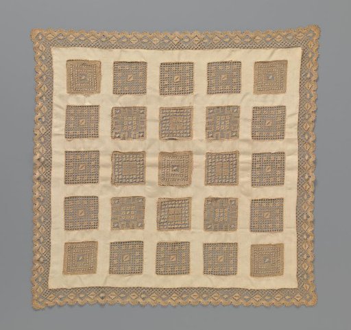 Tea tablecloth of beige silk with square inserts of light brown bobbin lace