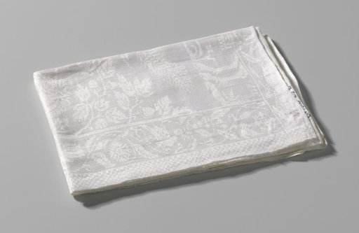 Linen damask napkin with a hunt featuring a horn-blowing Amazon