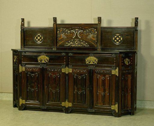 Buffet with drawers and doors decorated with letter panels and other Gothic ornaments. With carved monogram DVS