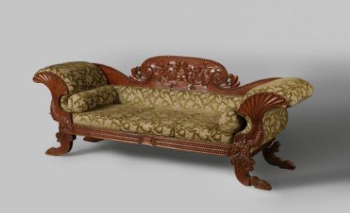 Teak daybed with three cushions and carved interlaced and staff motifs