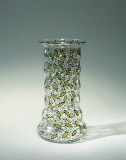Vase decorated with green and black leafy scrolls