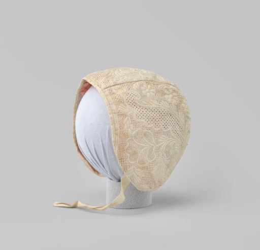 Linen baby cap with Zaan embroidery on an openwork ground; lining of pink silk