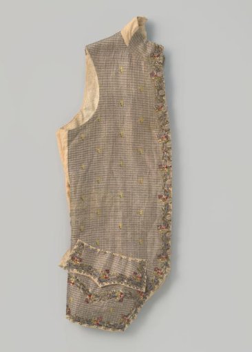 Vest of silver lamé with a floral scatter motif and multicoloured flower motifs of silver sequins