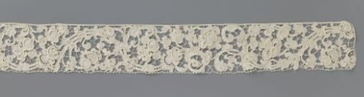 Strip of needle lace with baroque flower and leaf scrolls