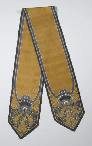 Long rectangular batik shawl in yellow-gold, blue, white and green, with an unfinished central section and a standing figure with outstretched arms at both ends