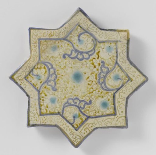 Star-shaped tile with an inscription and floral scrolls
