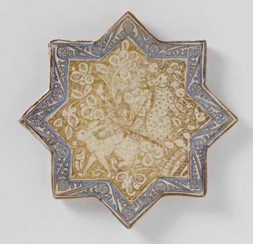 Star-shaped tile with hares among floral scrolls