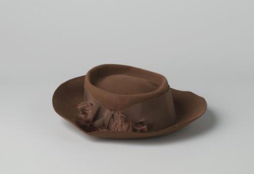 Hat of Brown Felt with Upturned Brim and Slightly Sunken Crown Adorned with Brown Grosgrain and Bow
