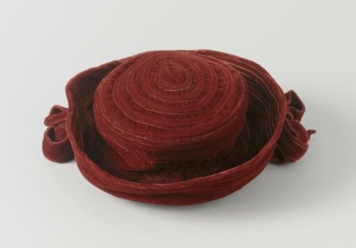 Hat of Wine-Red Quilted Velvet with Flat Straight Crown and Upturned Brim with Bows on Both Sides
