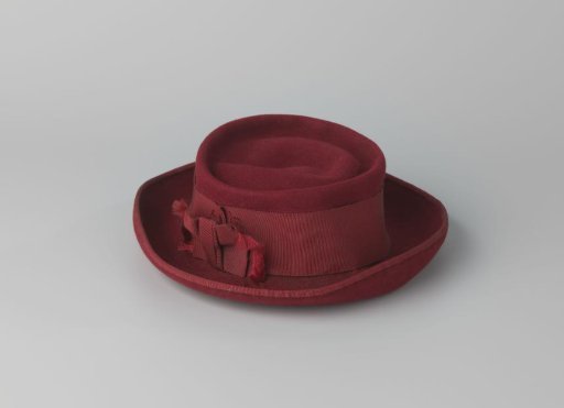 Hat of Wine-Red Felt with Upturned Brim and Flat Sunken Crown, Decorated with Red Grosgrain Tied in a Bow on One Side