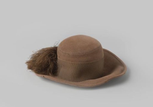 Small Hat of Brown Felt with Straight Crown and Wide Flat Brim, Decorated with Brown Grosgrain Frayed into a Tassel on the Right Side