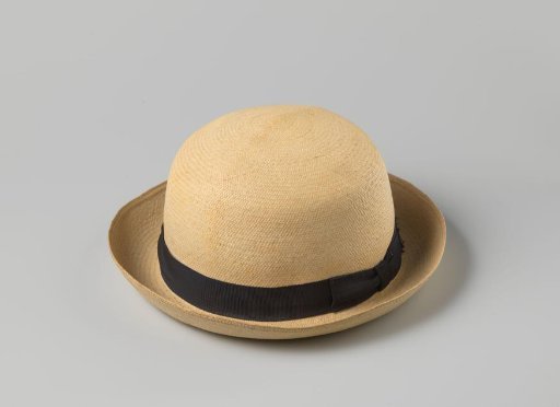 Children's hat of Panama straw with band of black grosgrain; on the inside the initials G.J.