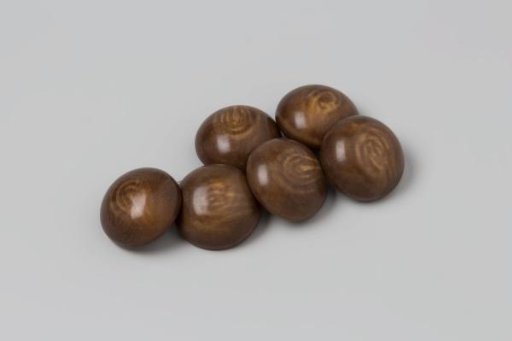 Six spherical buttons, made of brown and beige plastic (celluloid?) with a copper eye