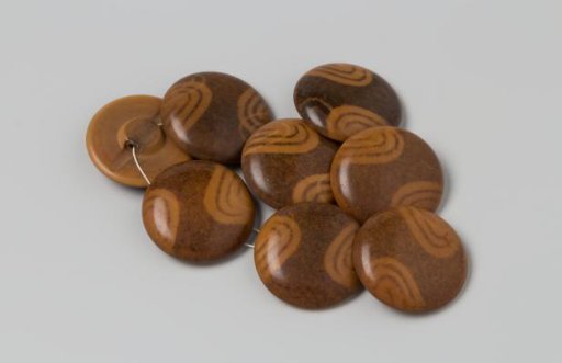 Buttons, flat, made of brown and beige plastic (celluloid?)
