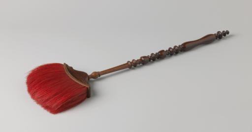 Bed warmer with a turned handle and a carved connecting piece to a red-painted bristle brush