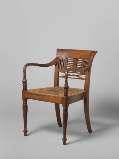 Armchair of teak wood with rattan-covered seat, so-called 'Raffles' chair