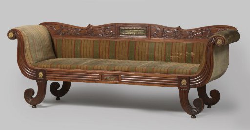 Sofa of padouk wood with brass fittings and green-and-red striped upholstery