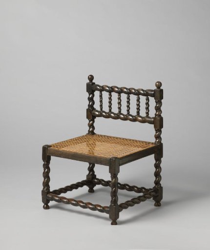 Chair of ebony with a rush seat