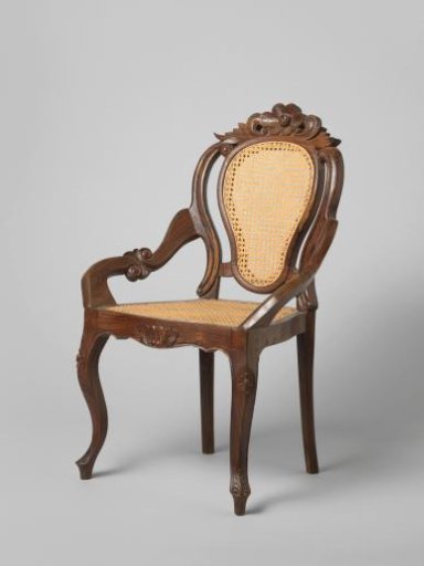 Armchair in neo-rococo style made of jatihout with a rattan seat