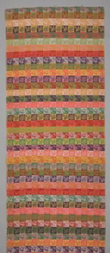 Piece of silk damask with a pattern of blocks in various color tones with floral ornaments, shields and geometric patterns