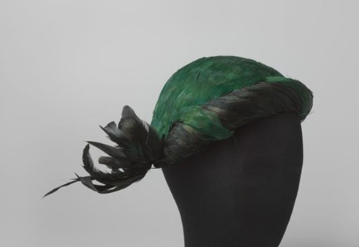 Cap with green and black feathers