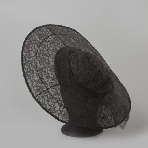 Hat, flat model, with machine-made lace featuring a floral design and a tulle bow