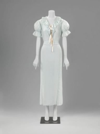 Nightgown of light blue pleated fabric, with pink ribbon