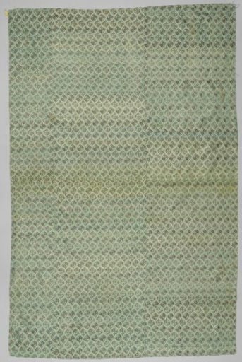 Fragment of silk with a diamond pattern containing flower branches