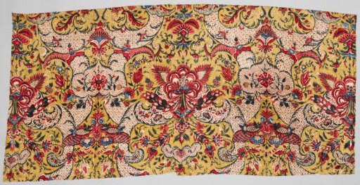 Fragment of a shawl with a symmetrical lace pattern and floral scrolls on an ochre ground