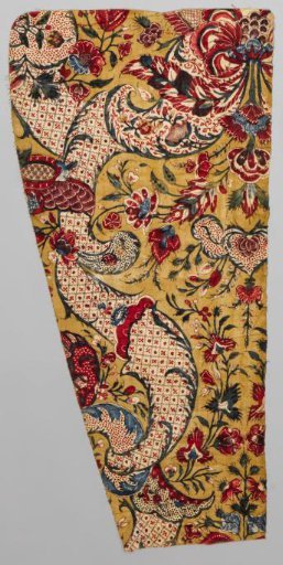 Fragment of a shawl with a symmetrical lace pattern and floral scrolls on an ochre ground