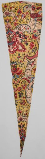 Fragment of a shawl with a symmetrical lace pattern and floral scrolls on an ochre ground