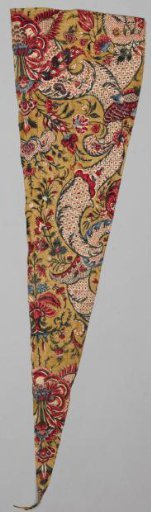 Fragment of a shawl with a symmetrical lace pattern and floral scrolls on an ochre ground