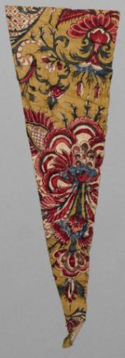 Fragment of a sari with symmetrical lace pattern and floral scrolls on an ochre ground