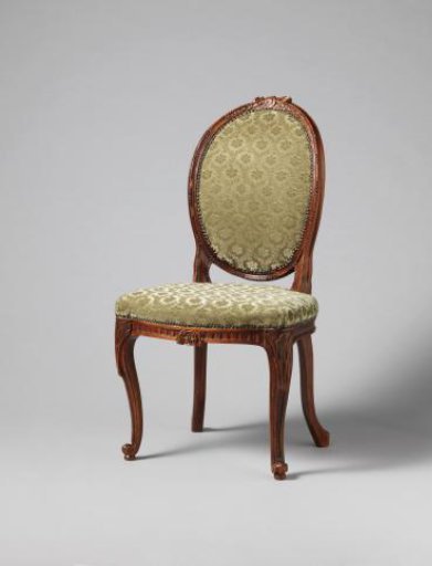 Chair with a profile-cut female head in the backrest cap within a medallion, flanked by laurel wreaths